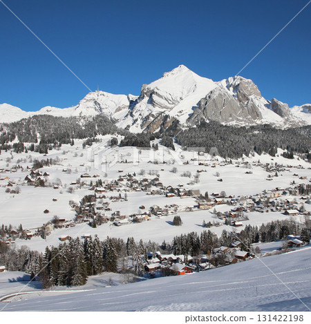 Village Wildhaus, mountains Santis and Altmann in winter, Switzerland. Village Wildhaus, mountains Santis and Altmann in winter, Switzerland. 131422198