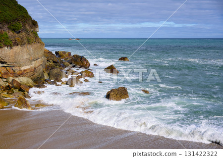 Rocky coastal beach with ocean waves Rocky coastal beach with ocean waves 131422322
