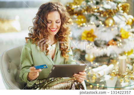 Woman Enjoying Online Holiday Shopping Indulgence Woman Enjoying Online Holiday Shopping Indulgence 131422357