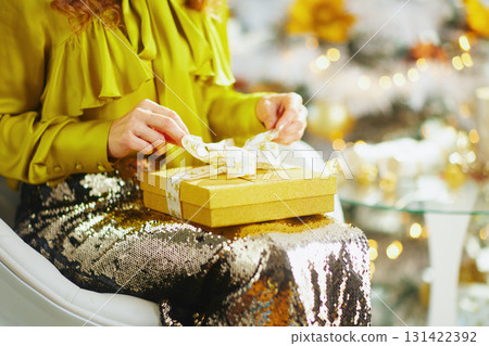 Anticipation: Opening a Golden Holiday Gift Anticipation: Opening a Golden Holiday Gift 131422392