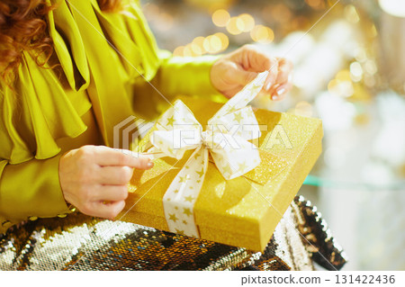 Excitement Unfolds: Golden Gift Box Moment Excitement Unfolds: Golden Gift Box Moment 131422436