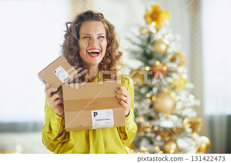 Excited Woman Receiving Christmas Deliveries Excited Woman Receiving Christmas Deliveries 131422473