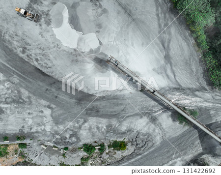 Aerial view of granite and limestone crushing plant with excavators processing raw stone into construction aggregates for concrete and infrastructure development. Stone mill factory. Aerial view of granite and limestone crushing plant with excavators processing raw stone into construction aggregates for concrete and infrastructure development. Stone mill factory. 131422692