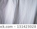 Texture of white fabric. White background close up. Factory fabric in white. 131423028