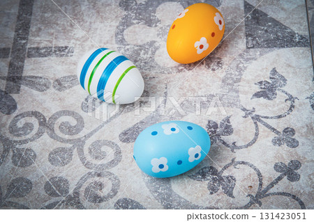 Easter. Multicolored eggs. Yellow and blue Easter decorations. 131423051