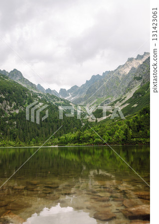 Breathtaking view of the mountains on a hiking trail. Location of the High Tatras Mountains, Europe. Breathtaking view of the mountains on a hiking trail. Location of the High Tatras Mountains, Europe. 131423061