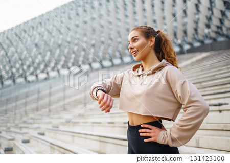 Fitness sport woman in sportswear doing sports on the street, outdoor sports. Active lifestyle. 131423100