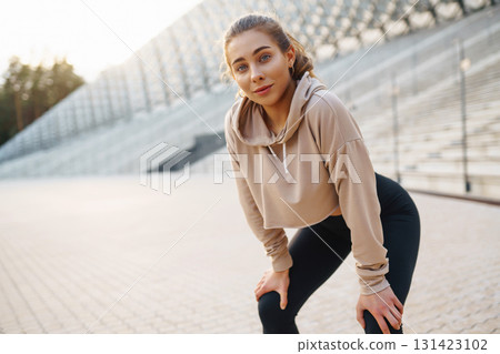 Fitness sport woman in sportswear doing sports on the street, outdoor sports. Active lifestyle. Fitness sport woman in sportswear doing sports on the street, outdoor sports. Active lifestyle. 131423102