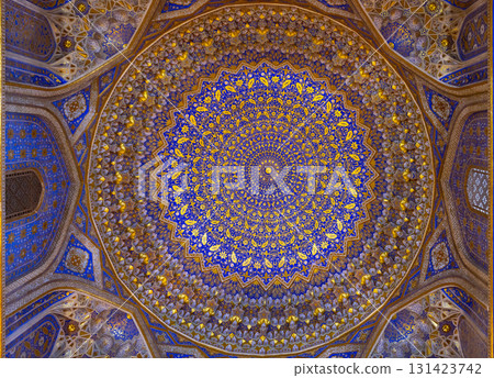 Geometrical designs in azure and gold adorn an arched ceiling. Samarkand Geometrical designs in azure and gold adorn an arched ceiling. Samarkand 131423742