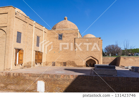 Street photography featuring ancient buildings with arches. Samarkand 131423746