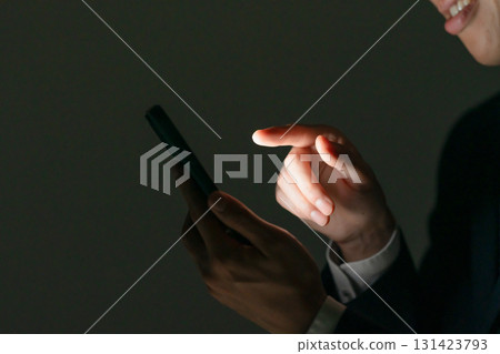 Suspicious man, smartphone, profile Suspicious man, smartphone, profile 131423793