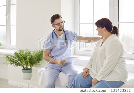 Overweight woman having consultation at doctor's office during medical examination in clinic. Overweight woman having consultation at doctor's office during medical examination in clinic. 131423832