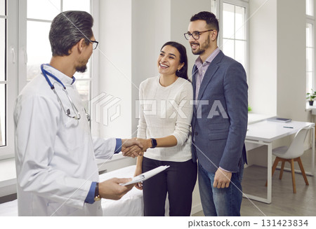 Young beautiful couple at doctor's appointment in the office of the Family planning medical center. 131423834