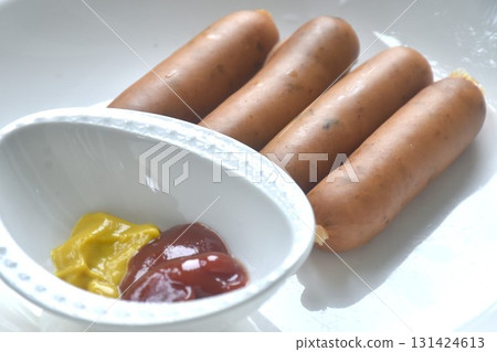 baking smoked Italian pork sausage arranging on plate dipping ketchup and mustard sauce baking smoked Italian pork sausage arranging on plate dipping ketchup and mustard sauce 131424613