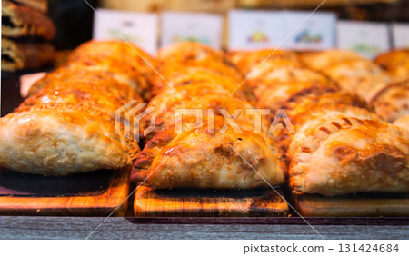 freshly baked empanadas with different fillings for sale freshly baked empanadas with different fillings for sale 131424684