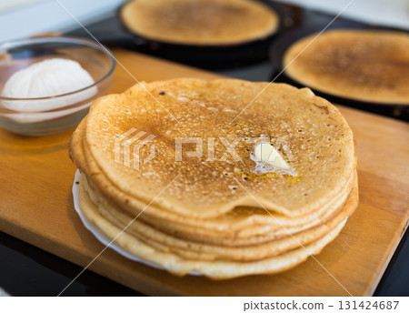 cooking traditional pancakes from wheat flour in the kitchen cooking traditional pancakes from wheat flour in the kitchen 131424687