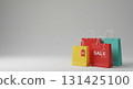 Colorful shopping bags with sale tags and gray background 131425100
