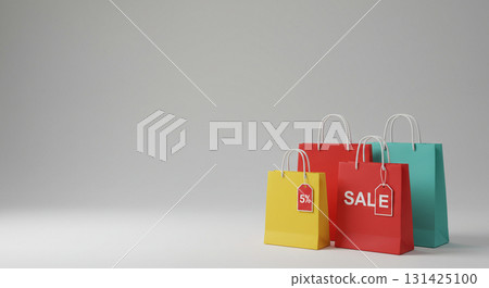 Colorful shopping bags with sale tags and gray background 131425100