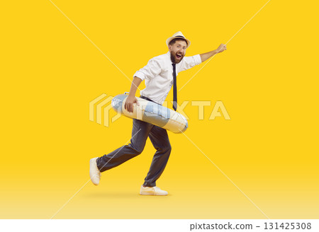 Happy funny excited male office worker with beach ring having fun on summer holiday 131425308