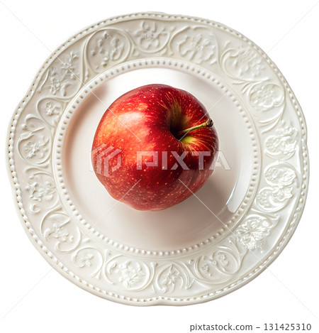 Single red apple on a white plate, top-down overhead view, minimalist still life isolated on transparent background for healthy food concepts 131425310