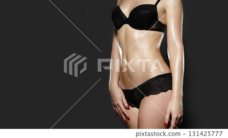 Sensual and confident female model showcasing beauty, femininity, and luxury in a stylish fashion shoot. Concept of self-confidence, body positivity, and intimate apparel 131425777