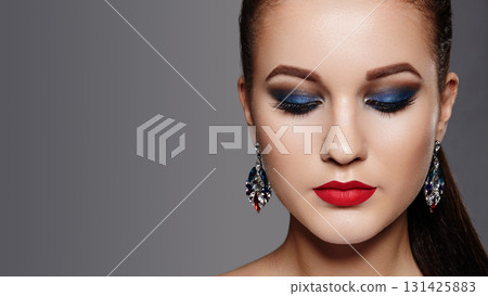 Closeup Portrait of Beautiful Woman with Celebrate Makeup, Luxury Accessories, Fashion Straight Hairstyle. Holiday Evening Style, Valentines day or Christmas Eve 131425883