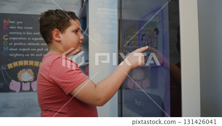 Primary School Student Taking Typology Test Using AI Mood Tracker Primary School Student Taking Typology Test Using AI Mood Tracker 131426041