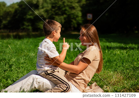 Caucasian millennial mother playing with son. Parenting topics. Happy family concept. Caucasian millennial mother playing with son. Parenting topics. Happy family concept. 131427109