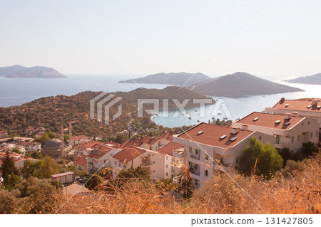 Beautiful coastal town with small white houses taken from above. Houses by the sea. Beautiful coastal town with small white houses taken from above. Houses by the sea. 131427805