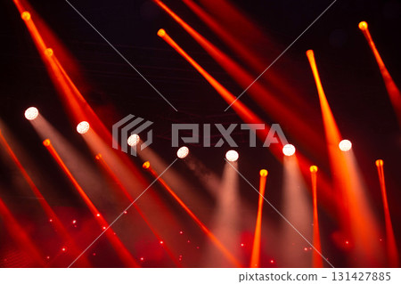 Stage white and red light beams on dark background. Stage lighting for concert. Stage white and red light beams on dark background. Stage lighting for concert. 131427885