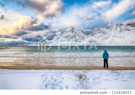 Amazing winter view of Vik beach during sunset with lots of snow  and snowy  mountain peaks near Leknes. 131428051