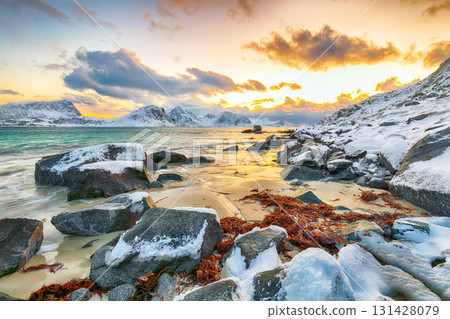 Unbeliveble winter view of Vik beach during sunset with lots of snow and snowy mountain peaks near Leknes. Unbeliveble winter view of Vik beach during sunset with lots of snow and snowy mountain peaks near Leknes. 131428079