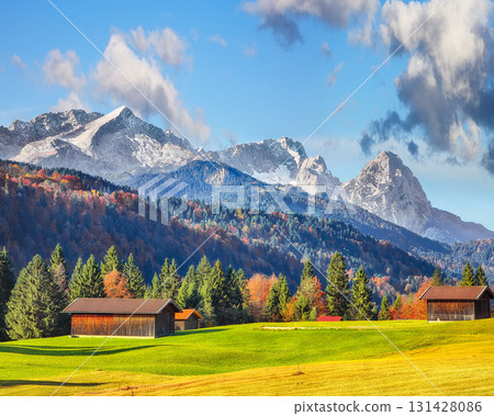 Fabulous view of alpine meadow with wooden huts  near Wagenbruchsee (Geroldsee) lake 131428086