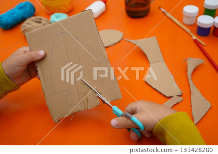 Design a fish figure from cardboard materials, thread, and paint, with a step-by-step tutorial, on an orange background. Design a fish figure from cardboard materials, thread, and paint, with a step-by-step tutorial, on an orange background. 131428280
