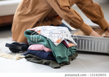 Stacked clothes and accessories for travel Stacked clothes and accessories for travel 131428935