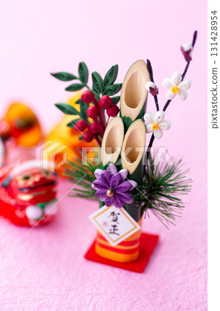 New Year's pine decoration on a pink background New Year's pine decoration on a pink background 131428954