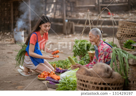 Women actively participate in cultural activities at local vegetable markets, enhancing community Women actively participate in cultural activities at local vegetable markets, enhancing community 131429197