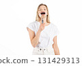 Studio portrait of woman with magnifying glass 131429313