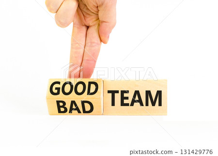 Good or bad team symbol. Concept words Good team Bad team on wooden cubes. Beautiful white table white background. Businessman hand. Business and good or bad team concept. Copy space. 131429776