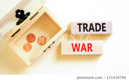 Trade war symbol. Concept word Trade war on beautiful wooden blocks. Beautiful white paper background. Beautiful wooden chest with coins. Business trade war concept. Copy space. 131429790