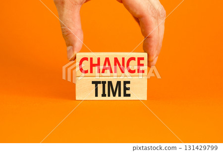 Chance time symbol. Concept word Chance time on beautiful wooden blocks. Beautiful orange paper background. Businessman's hand. Business chance time concept. Copy space. Chance time symbol. Concept word Chance time on beautiful wooden blocks. Beautiful orange paper background. Businessman's hand. Business chance time concept. Copy space. 131429799