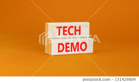 Tech demo symbol. Concept word Tech demo on beautiful wooden blocks. Beautiful orange paper background. Business tech demo concept. Copy space. Tech demo symbol. Concept word Tech demo on beautiful wooden blocks. Beautiful orange paper background. Business tech demo concept. Copy space. 131429804