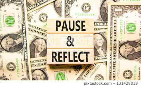 Pause and reflect symbol. Concept words Pause and reflect on beautiful block. Dollar bills. Beautiful background from dollar bills. Business motivational lifestyle pause and reflect concept Copy space 131429819