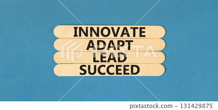 Innovate adapt lead succeed symbol. Concept words Innovate Adapt Lead Succeed on beautiful wooden sticks. Beautiful blue background. Business innovate adapt lead succeed concept. Copy space. Innovate adapt lead succeed symbol. Concept words Innovate Adapt Lead Succeed on beautiful wooden sticks. Beautiful blue background. Business innovate adapt lead succeed concept. Copy space. 131429875