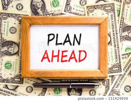 Plan ahead symbol. Concept word Plan ahead on beautiful wooden picture frame. Dollar bills. Beautiful dollar bills background. Black pen. Business plan ahead concept. Copy space. 131429939