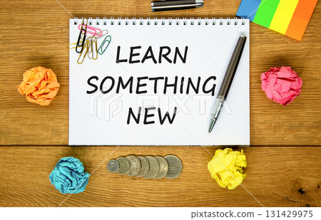 Learn something new symbol. Concept words Learn something new on beautiful white note. Black pen. Beautiful wooden background. Business motivational lifestyle learn something new concept. Copy space. 131429975