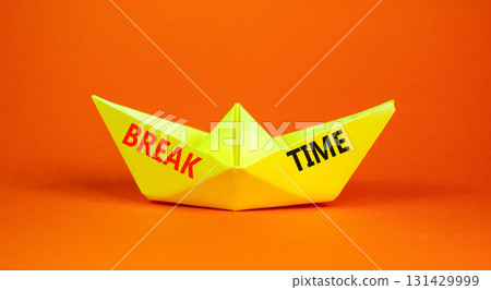 Break time symbol. Concept word Break time on beautiful yellow paper boat. Beautiful orange paper background. Business break time concept. Copy space. 131429999