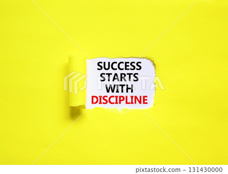 Success starts with discipline symbol. Concept words Success starts with discipline on beautiful white paper. Beautiful yellow background. Business success starts with discipline concept. Copy space 131430000