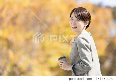 A woman drinking hot coffee 131430020