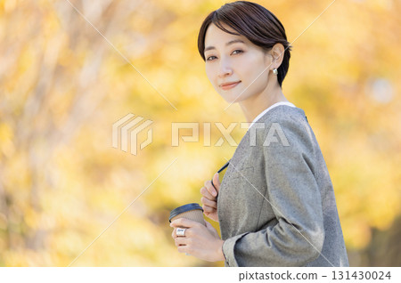 A woman drinking hot coffee 131430024